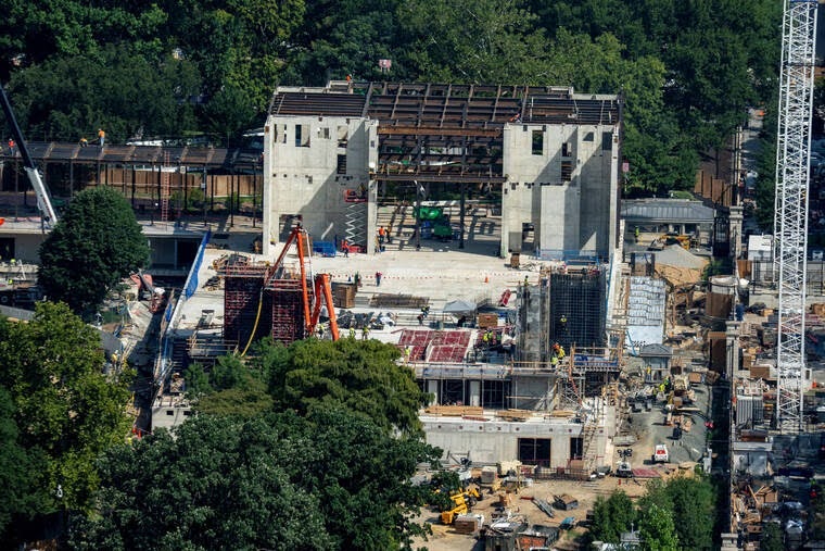 Aerial view of construction crews and cranes at the demolished East Wing of the White House
